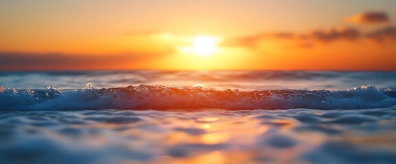 Fototapeta premium Stunning sunset over ocean waves in tranquil coastal setting during golden hour