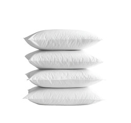 Stack of four white rectangular pillows
