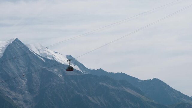 Gondola car to Brevent crosses in front of the Mont Blanc Massif in Chamonix Valley France