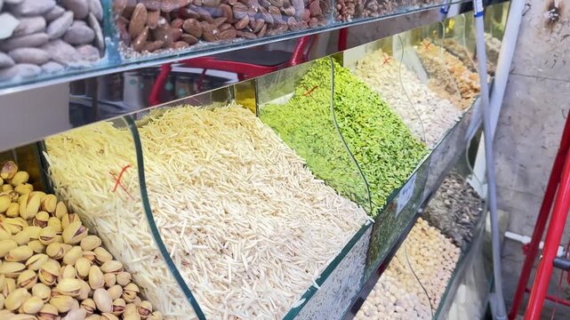 Sliced nuts in local market shop pistachio almond hazelnut in store Iran old bazaar assorted mix raw salted snack sunflower table nut variation vegetarian walnuts energy traditional healthy food