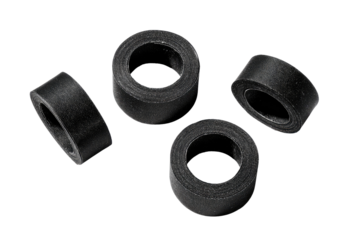 Four small, black, rubber rings arranged in a loose group