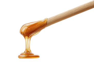 Sweet, amber-colored syrup drips from wooden applicator