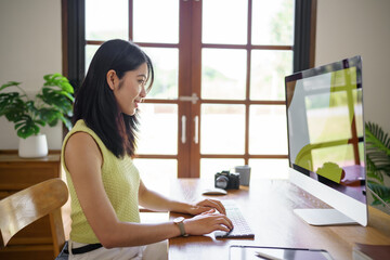 Graphic designer working on digital tablet and computer. Designer Asian Woman artist drawing on...