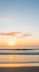 Obraz premium Serene Coastal Sunrise with Golden Light Reflecting on Calm Ocean Waves
