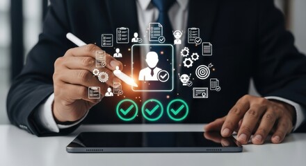 Fototapeta premium A person uses a stylus on a tablet, interacting with a profile icon and various business process icons, signifying user management and approval
