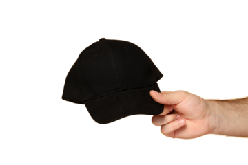 Hand presenting a black cap for casual style, isolated on white, PNG