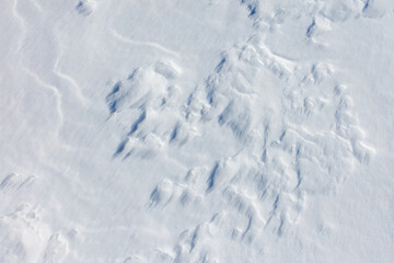 The snow is white and the ground is covered in it