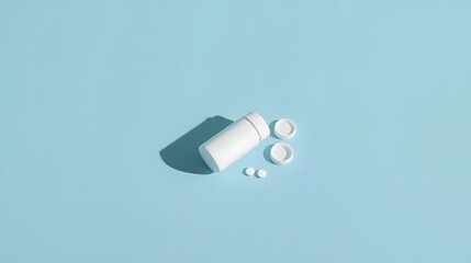 Minimalist concept with white medicine bottle and scattered tablets on light blue background, symbolizing healthcare, pharmaceutical treatment, medical therapy and wellness