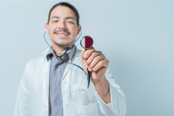 Smiling doctor showing stethoscope with Qatar flag. Qatar national healthcare
