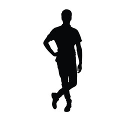 A high-quality silhouette of a man in a relaxed yet confident pose, standing with one hand on his hip and legs crossed.