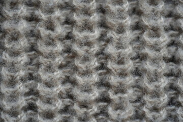 texture of knitted light brown sweater, close-up texture of beige knitted fabric, macro texture of tan knitted woolen clothes	
