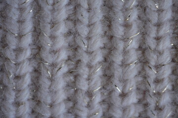 ribbed gray knitted fabric texture close-up macro texture of brown crocheted sweater as background, close-up of browncrocheted front surface, woolen texture of woolen wool, knitted front surface	
