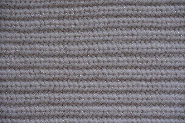 ribbed gray knitted fabric texture close-up macro texture of brown crocheted sweater as background, close-up of browncrocheted front surface, woolen texture of woolen wool, knitted front surface	
