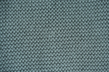  marsh texture of knitted fabric, macro texture of green wool fabric, geometric knitted pattern of crocheted elastic as a background