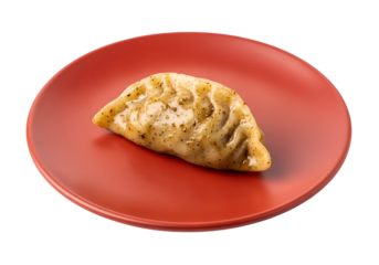 Single, savory dumpling rests on a vibrant red plate, showcasing its golden-brown crust and glistening sauce.