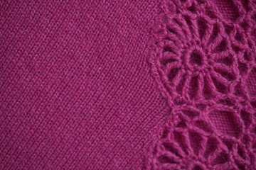 Pink fabric with crochet lace border. Elegant handmade textile with decorative floral edge pattern, ideal for fashion, design, and craft backgrounds.
