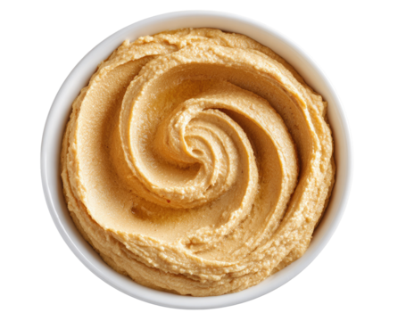 Creamy hummus in a white bowl, swirls of dip