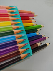 colored pencils on white background