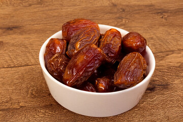 dried dates on a wooden table