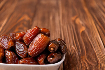 dates in a wooden bowl