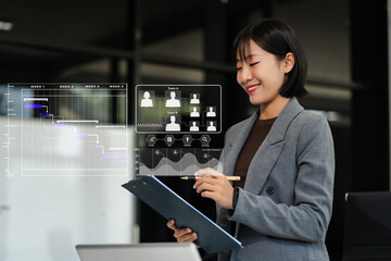 woman hand Project manager working and update tasks and Gantt chart scheduling virtual diagram with smart phone and laptop in office
