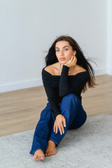Vertical portrait of happy beautiful Caucasian business lady. Cheerful, positive young professional girl, manager, employee posing for portrait, looking at camera
