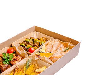 Delicious assorted meal featuring grilled fish and vegetables in a box