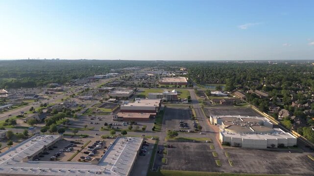 Drone view over South Tulsa near South Memorial and E 101st&mdash;where big-box stores, leafy neighborhoods, and weekday buzz blend into a laid-back Oklahoma rhythm.