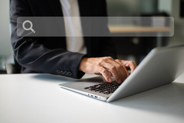 Searching Browsing Internet Data Information Networking Concept with blank search bar.man hand typing laptop