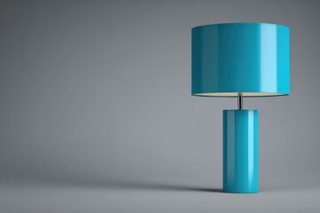 Teal cylindrical table lamp on grey background