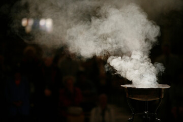 Incense burning in Paris cathedral.  Paris. France.