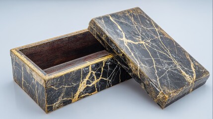 Dark, textured rectangular box with a metallic gold veined pattern, lid ajar