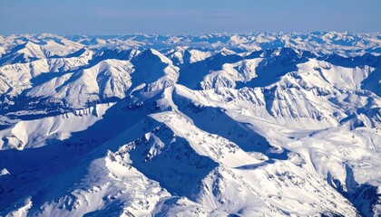 Naklejka premium Aerial View of Snowy Mountain Ridges and Alpine Contours