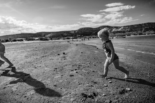 Children playing on shore of Green River in Utah