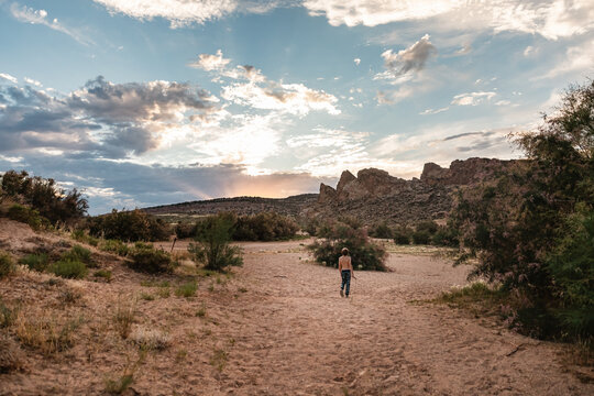 Child wandering in scenic landscape in Utah