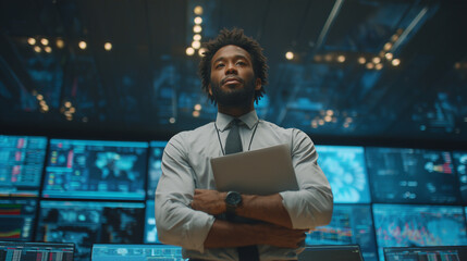 Final empowering scene: businessman standing confidently, laptop closed under one arm, digital screens still glowing behind, upper frame clear for headline.