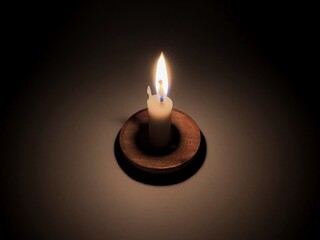 Candle light at night. Burning candle in darkness with focus. White candle burning in the dark,...