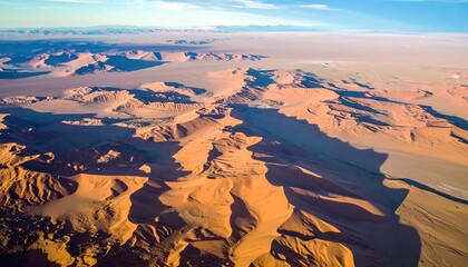 Aerial View of Warm Beige Sand Dunes and Rock Formations
