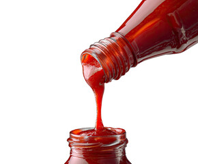 Red sauce pouring from a bottle into a jar