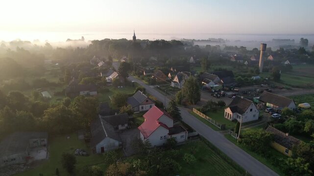 Church in the fog dawn in Krakes Lithuania