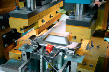 Spot welding process of microwave oven casing in a manufacturing facility during production...