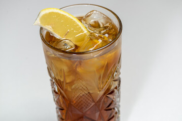 cocktail rum and cola in a tall glass macro photo