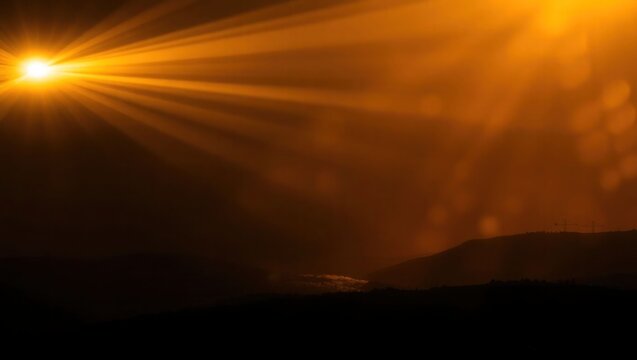 sun rays shining through the clouds