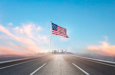 United States national flag with mast waving with beautiful skyline. A view from highway. American...