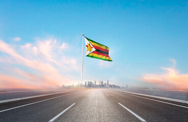 Zimbabwe national flag with mast waving with beautiful skyline. A view from highway. Zimbabwe flag...
