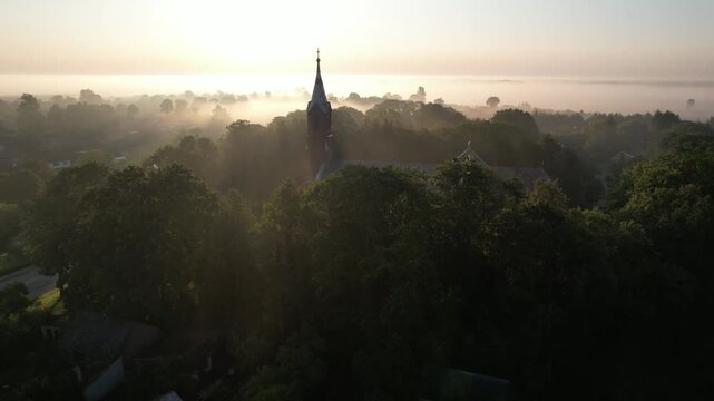 Church in the fog dawn in Krakes Lithuania