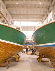 Two boats in a workshop