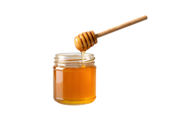 Wooden honey dipper dripping golden honey into clear glass jar filled with amber colored sweetener, isolated on a transparent background
