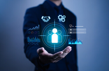 Businessman showing digital customer relationship management icon with data analytics, teamwork, business strategy concept, symbolizing CRM technology, corporate growth, client engagement solutions.
