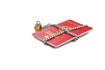 Passports with a lock and key on top.